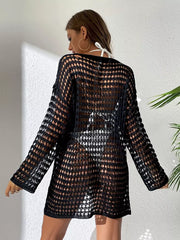 Black sheer crochet knit cover-up with openwork pattern and long sleeves.