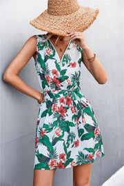White floral mini dress with zip front and tie waist
