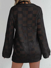 Black openwork crochet cover-up with long sleeves and a tie-front detail.