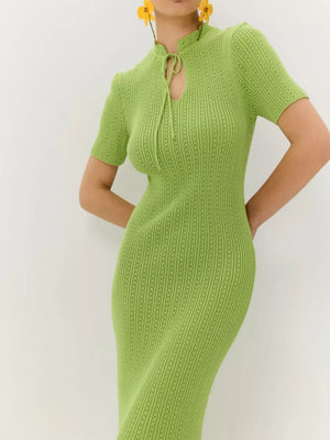 Lime knit mermaid dress with tie neckline and short sleeves.