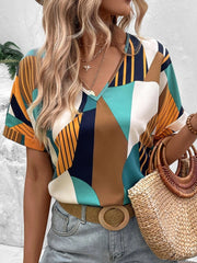 Geometric print V-neck blouse with short sleeves in multicolor.