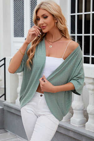 Light green open-front crochet kimono sleeve top with a subtle circular pattern.