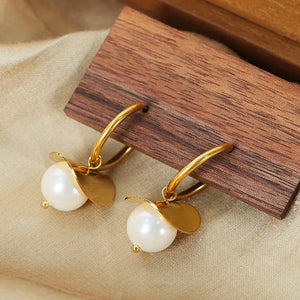 Gold hoop earrings with pearl and petal detail