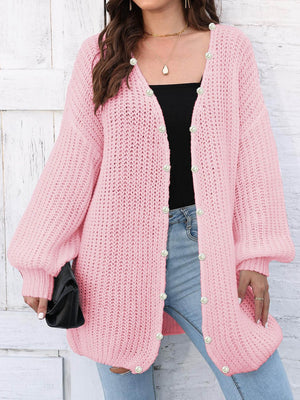 Blush pink balloon sleeve cardigan with pearl buttons and open front.