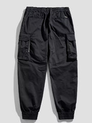 Black cargo joggers with flap pockets and zippered details.