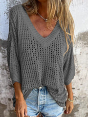 Dark gray open-knit V-neck sweater with relaxed fit and short sleeves.