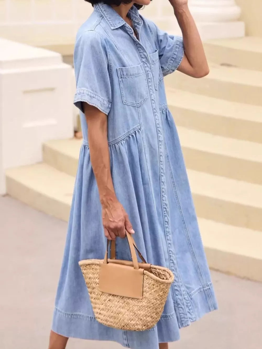 Chic button-front denim midi dress with short sleeves and tiered skirt.