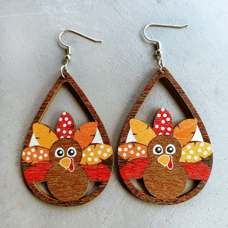 Thanksgiving turkey dangle earrings with colorful feathers and polka dots.