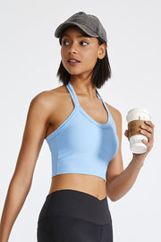 Light blue ribbed halter crop top with a racerback detail.