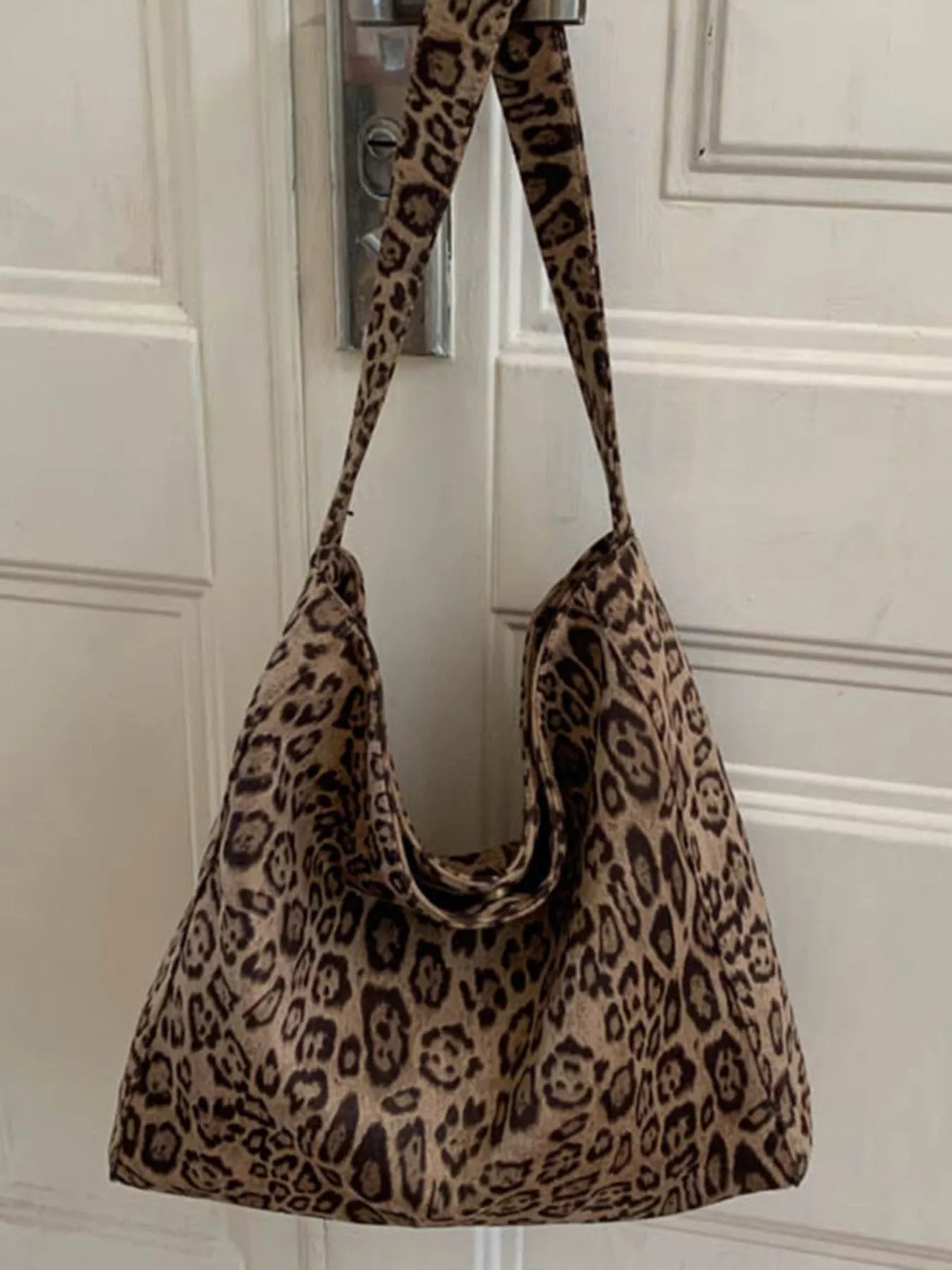 Stylish leopard print tote bag in khaki with slouchy silhouette and single strap.