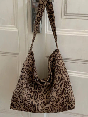 Stylish leopard print tote bag in khaki with slouchy silhouette and single strap.