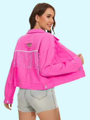 Hot pink distressed denim jacket with crystal fringe and ripped back detail.