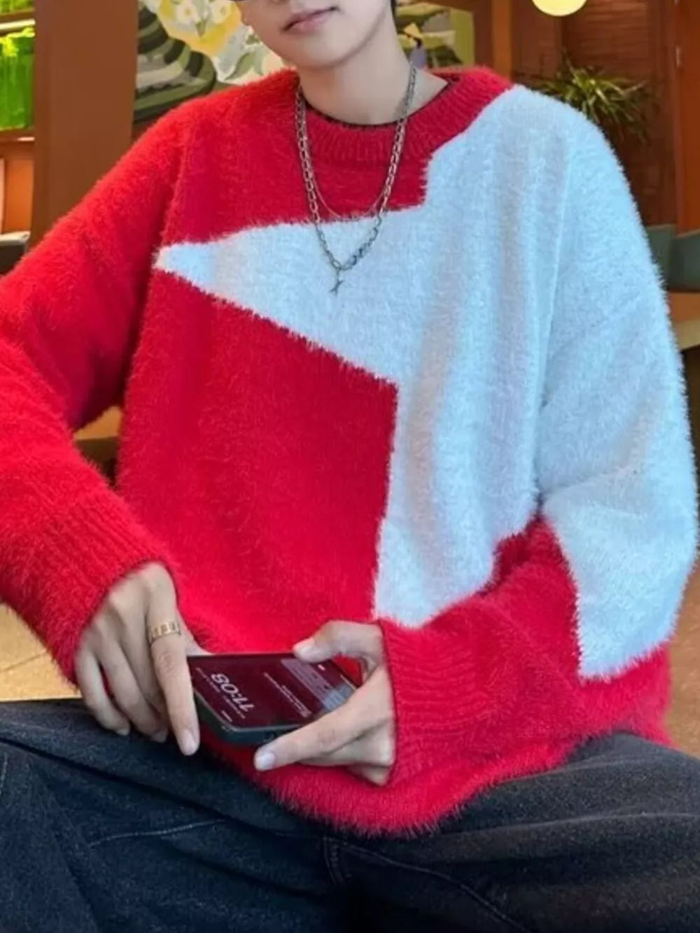 Men's red and white fuzzy knit crew neck sweater with geometric pattern.