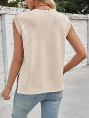 Beige ribbed V-neck sweater vest with side slits, made of acrylic blend.
