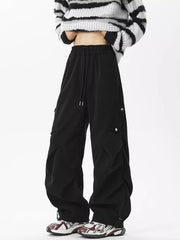 Black comfortable cargo sweatpants with drawstring waist and snap-button cargo pockets.