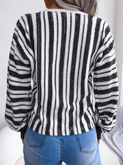 Black and white striped knit cropped pullover sweater with long sleeves.