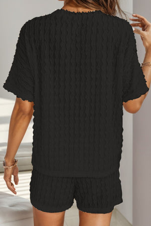 Black textured bouclé tee and drawstring shorts set with short sleeves and lettuce hem detail.