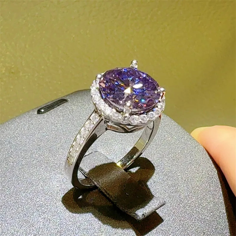Violet halo sterling silver ring with oval purple center stone and pave band.