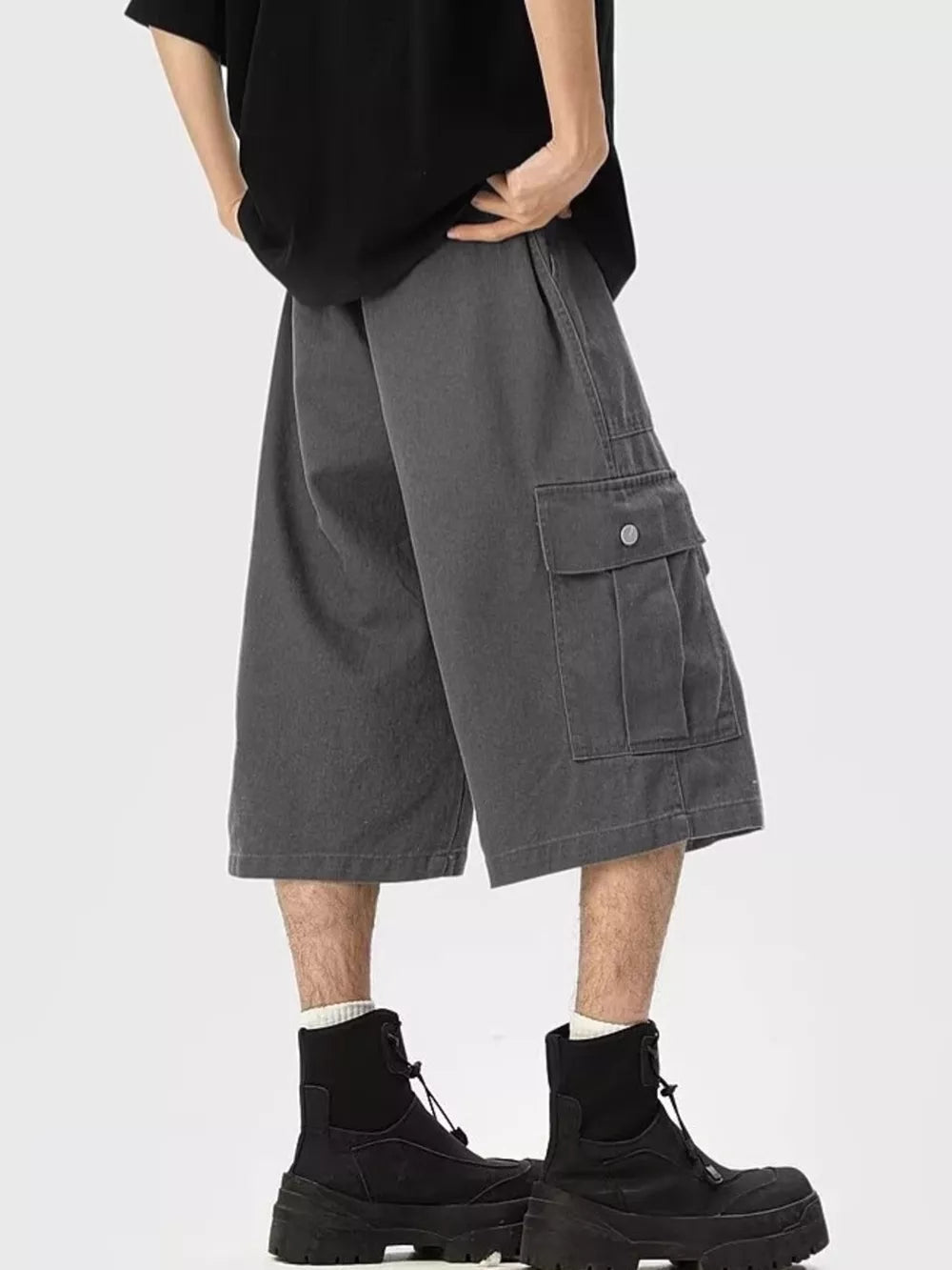 Relaxed fit dark gray cargo sweatpants cropped with side pocket detail.