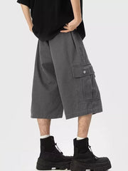Relaxed fit dark gray cargo sweatpants cropped with side pocket detail.
