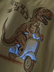 Toddler t-shirt with a brown dinosaur graphic wearing a checkered scarf and riding a blue scooter.