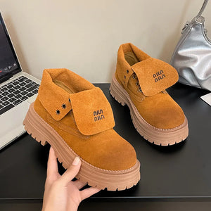 Fold-over suede platform boots in pumpkin with embroidered branding and lug sole.