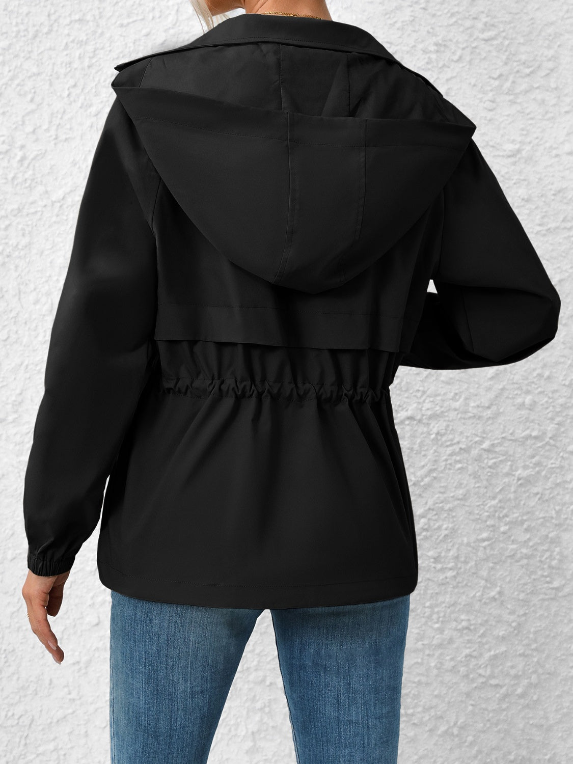 Black hooded utility jacket with cinched waist detail