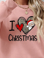Blush pink crewneck sweatshirt with festive heart graphic and Santa detail.