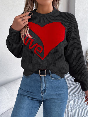 Black knit sweater with a red heart and "love" graphic, crew neck, long sleeves.