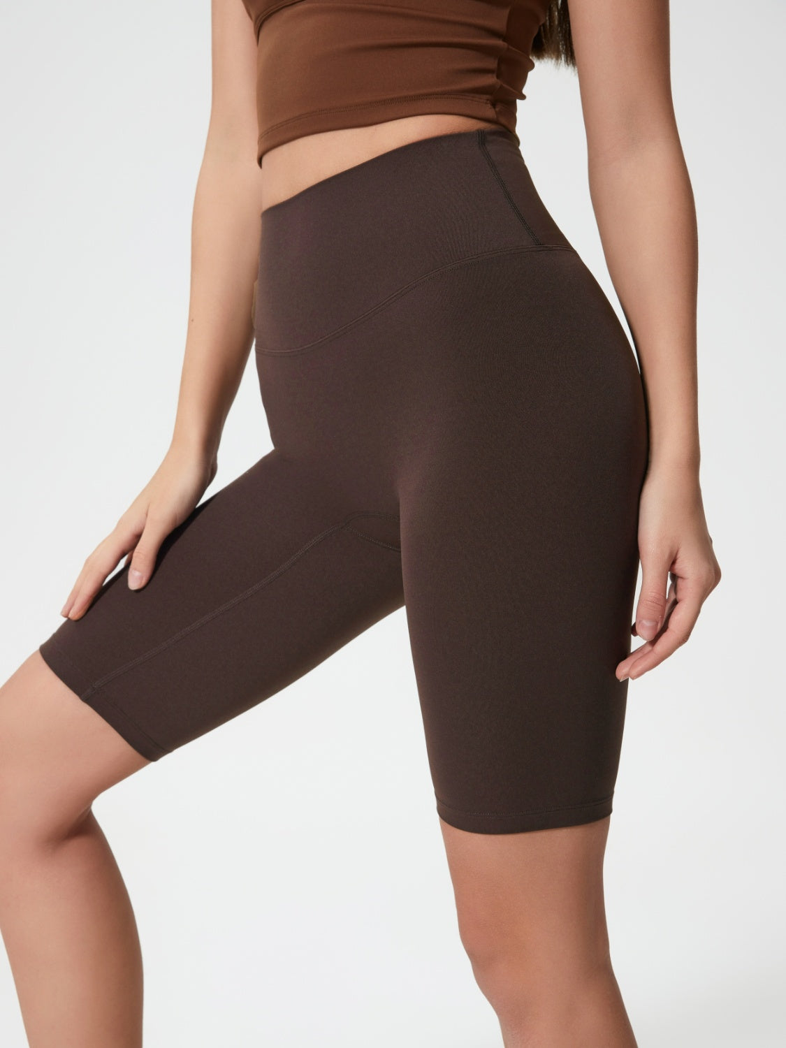 Sculpted Contour Active Cycling Shorts in Dark Brown with a high waist and seamless design.