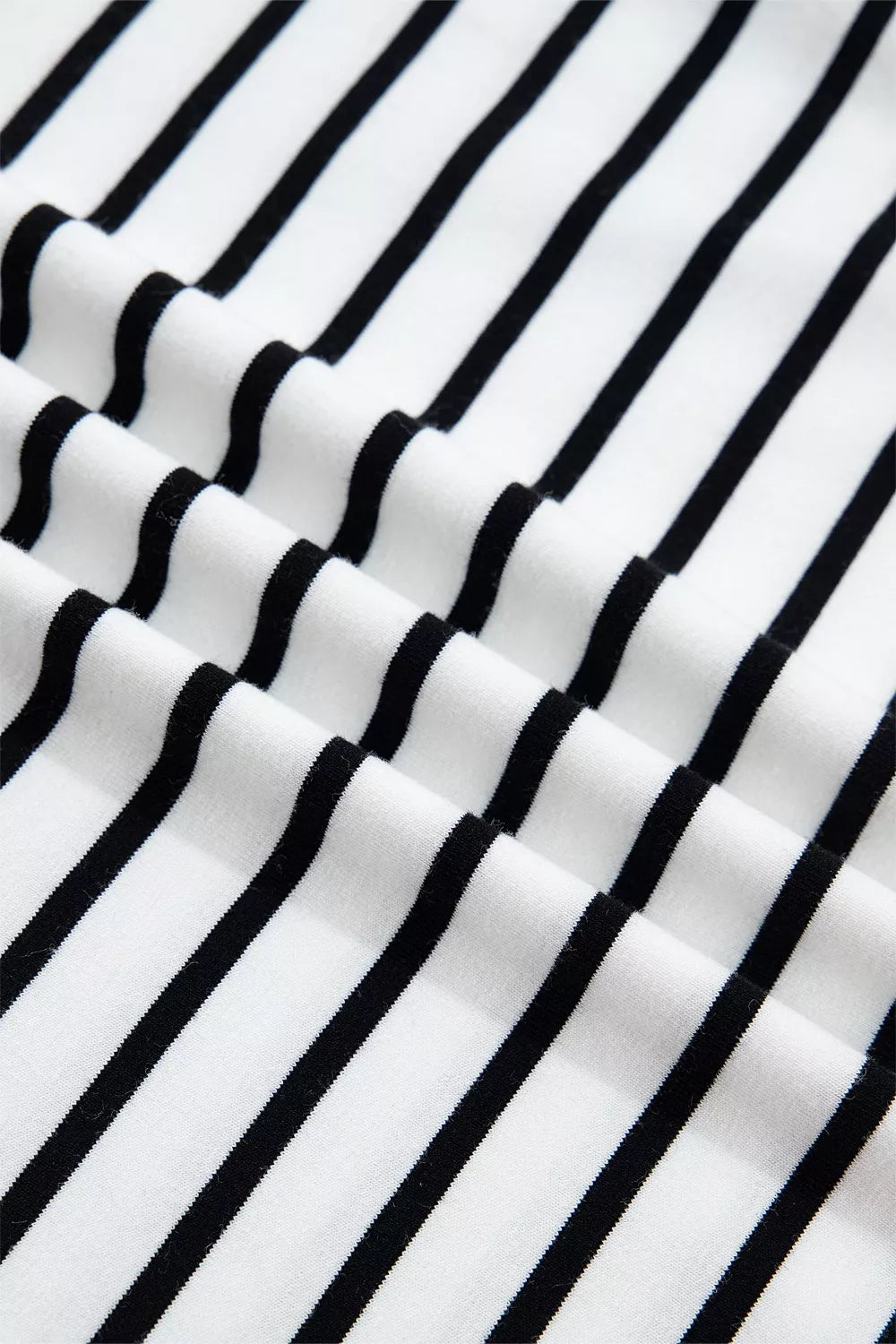 White cotton tank top with black stripes and ruffled detail.