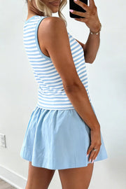 Blue and white striped tank top with a light blue a-line skort.
