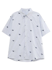 White and blue plaid short sleeve button up shirt with embroidered animal motifs.