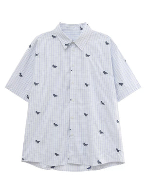 White and blue plaid short sleeve button up shirt with embroidered animal motifs.