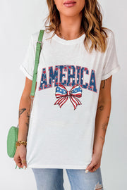 White graphic tee with America text and patriotic bow motif