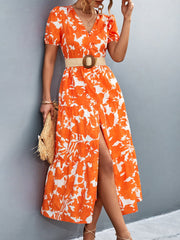 Orange-red floral print midi dress with puff sleeves, V-neck, tiered skirt, and thigh slit.