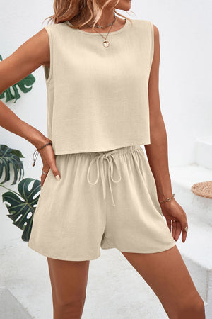 Beige textured crop top and shorts set with adjustable drawstring shorts.