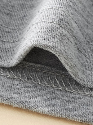 Grey toddler t-shirt detail showing crew neck seam and stitching.