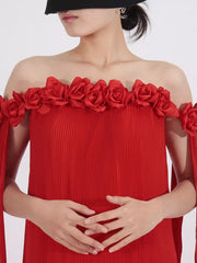 Red off-shoulder maxi dress with floral appliques and pleated fabric