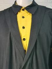 Black polo shirt with yellow front and asymmetric lapel detail.