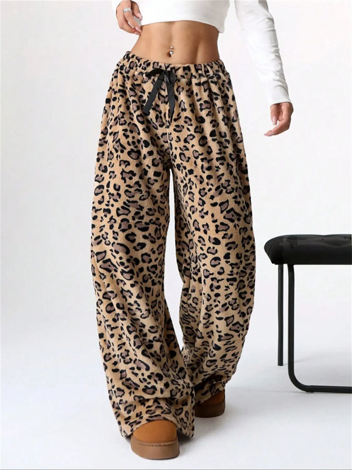 Leopard print lounge palazzo trousers with black bow detail and wide leg.