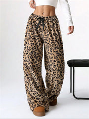 Leopard print lounge palazzo trousers with black bow detail and wide leg.