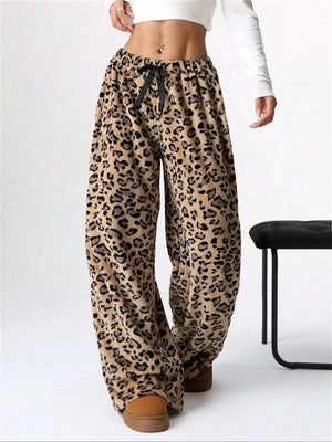 Leopard print lounge palazzo trousers with black bow detail and wide leg.