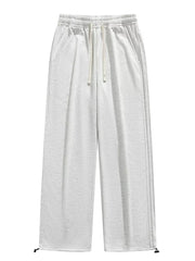 Lightweight wide-leg men's sweatpants in light gray with drawstring and adjustable cuffs.
