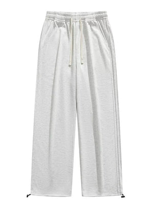 Lightweight wide-leg men's sweatpants in light gray with drawstring and adjustable cuffs.