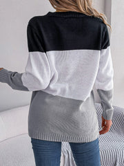Colorblock cable knit cardigan in black, white, and grey acrylic.