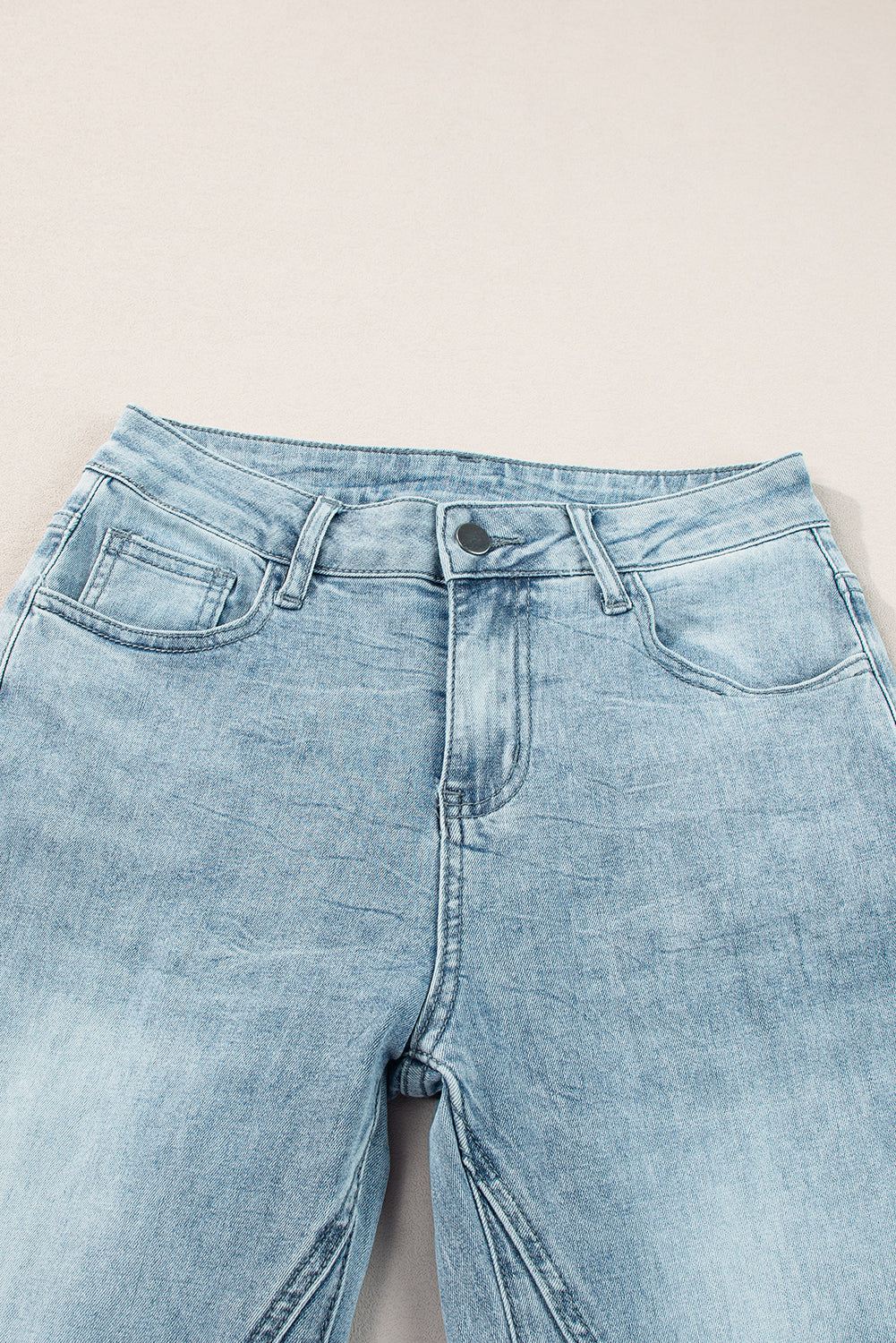 High-waisted palazzo flare denim jeans in medium wash with a button fly and five-pocket styling.