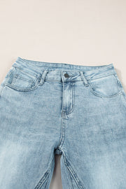 High-waisted palazzo flare denim jeans in medium wash with a button fly and five-pocket styling.