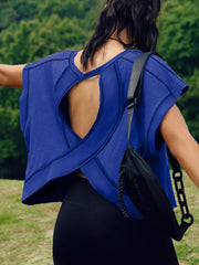 Royal blue t-shirt with cutout back detail and crisscross straps, contrast stitching.