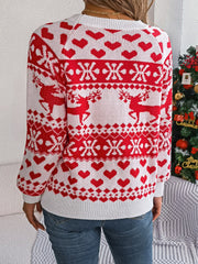 White acrylic sweater with red reindeer, snowflake, and heart jacquard pattern.
